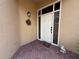 Close up of the front door, sidelights, and brick paving at 2622 Clarinet Dr, Orlando, FL 32837
