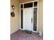 Charming entryway featuring a front door with sidelights and brick flooring at 2622 Clarinet Dr, Orlando, FL 32837