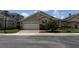 Charming single-story home with a brick driveway, two-car garage, and well-maintained landscaping at 2622 Clarinet Dr, Orlando, FL 32837