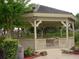 An outdoor gazebo offering shaded seating, surrounded by lush landscaping at 2622 Clarinet Dr, Orlando, FL 32837