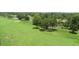 Expansive green golf course with pond and mature trees at 2622 Clarinet Dr, Orlando, FL 32837