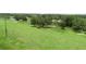 View of lush green grounds with trees and bodies of water in the background at 2622 Clarinet Dr, Orlando, FL 32837