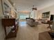 Elegant sitting area with a grand piano and lots of light at 2622 Clarinet Dr, Orlando, FL 32837