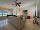 Inviting living room with a piano, tile floors, and a ceiling fan at 2622 Clarinet Dr, Orlando, FL 32837