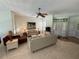 Spacious living room showcasing tile floors, comfortable seating, and elegant decor at 2622 Clarinet Dr, Orlando, FL 32837
