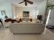 Bright living room with tile floors, ample seating, ceiling fan, and natural light at 2622 Clarinet Dr, Orlando, FL 32837