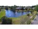 Picturesque pond with a fountain surrounded by lush landscaping and mature trees at 2622 Clarinet Dr, Orlando, FL 32837