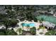 A community pool with a hot tub, tennis courts and well maintained landscaping in an aerial view at 2622 Clarinet Dr, Orlando, FL 32837