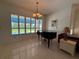 Bright sitting area with large windows offering pool views, complete with a piano at 2622 Clarinet Dr, Orlando, FL 32837