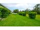 Expansive backyard featuring lush greenery and mature trees, creating a private outdoor space at 3142 Dark Sky Dr, Harmony, FL 34773