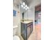 Cozy bathroom featuring granite countertops and a view into the hallway at 3142 Dark Sky Dr, Harmony, FL 34773