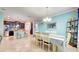 The open-concept dining room is connected to the kitchen and living area for easy entertaining and Gathering meals at 3142 Dark Sky Dr, Harmony, FL 34773