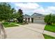 Charming home with a well-manicured lawn, two-car garage, and inviting front porch at 3142 Dark Sky Dr, Harmony, FL 34773