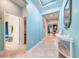 Bright hallway with tile floors leading to various rooms, including a bathroom and bedroom at 3142 Dark Sky Dr, Harmony, FL 34773