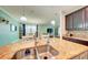A kitchen island sink overlooks the dining and living areas, offering an open-concept layout with granite countertops at 3142 Dark Sky Dr, Harmony, FL 34773
