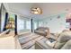 Spacious living room featuring comfortable seating, a mounted television, and an open floor plan at 3142 Dark Sky Dr, Harmony, FL 34773