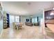 The open-concept living space blends the living room, dining area, and kitchen for modern living at 3142 Dark Sky Dr, Harmony, FL 34773