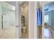 View of a conveniently-located powder room next to the laundry and a bedroom at 3142 Dark Sky Dr, Harmony, FL 34773