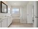 Bathroom with double sinks, a soaking tub, a shower, and natural light from a window at 3326 Sassaquin Ct, Orlando, FL 32818