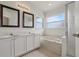 Bathroom featuring double sinks, soaking tub, shower, and ample natural light for relaxation at 3326 Sassaquin Ct, Orlando, FL 32818