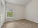 Cozy bedroom with wood-look flooring and natural light, providing a relaxing atmosphere at 3326 Sassaquin Ct, Orlando, FL 32818