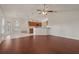 Spacious living room boasts wood flooring, lots of natural light, and an eat-in kitchen at 3326 Sassaquin Ct, Orlando, FL 32818