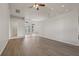 Expansive living area showcasing wood-look floors, high ceilings, and an open layout at 3326 Sassaquin Ct, Orlando, FL 32818