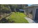 Backyard featuring a well-maintained lawn and secure black chain-link fence at 35 Olive Cir, Ocala, FL 34472
