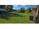 Expansive backyard featuring a large grassy area, perfect for outdoor activities and relaxation at 35 Olive Cir, Ocala, FL 34472