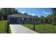 Charming single-story home featuring a well-maintained lawn and a cozy front porch at 35 Olive Cir, Ocala, FL 34472