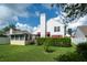 Exterior view of the home's backyard featuring a well-manicured lawn at 3585 Ventura Club Cir, Orlando, FL 32822