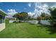 Well maintained backyard with a green lawn and shed at 3585 Ventura Club Cir, Orlando, FL 32822