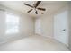 Spacious bedroom features a ceiling fan, a window, and a closet at 3585 Ventura Club Cir, Orlando, FL 32822