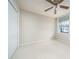 Bedroom with a ceiling fan, window and a closet at 3585 Ventura Club Cir, Orlando, FL 32822