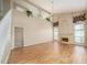 Bright living room with soaring ceilings, wood floors, a fireplace, and large windows at 3585 Ventura Club Cir, Orlando, FL 32822