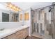 Bathroom with a double sink vanity and custom tiled shower stall at 411 Racoon Trl, Geneva, FL 32732