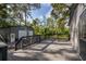 Wooden deck overlooking a two-car garage and wooded area, offering a private outdoor space at 411 Racoon Trl, Geneva, FL 32732