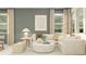 Comfortable living room with neutral tones, a large sectional sofa, and stylish decor at 4560 Ochos Rios Pl, Kissimmee, FL 34758