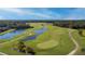 Scenic aerial view of golf course and surrounding natural landscapes at 461 Brunswick Dr, Davenport, FL 33837