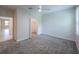 This bedroom features a window, carpet, ceiling fan, and a walk-in closet at 461 Brunswick Dr, Davenport, FL 33837