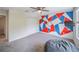 Bedroom with an unique wall design, closet, and carpet floors at 461 Brunswick Dr, Davenport, FL 33837