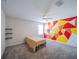 Spacious bedroom featuring a colorful wall design, carpet floors, ceiling fan, and black shelves at 461 Brunswick Dr, Davenport, FL 33837