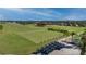 Aerial view of the golf course with golf cart parking at Providence in Davenport, FL at 461 Brunswick Dr, Davenport, FL 33837