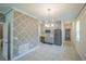 Kitchen features modern stainless steel appliances, tile flooring, and modern pendant lighting at 461 Brunswick Dr, Davenport, FL 33837