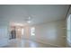 A large living room with tiled floors connects to the kitchen at 461 Brunswick Dr, Davenport, FL 33837