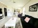 Spacious living room flowing into an adjacent kitchen and dining area at 461 Brunswick Dr, Davenport, FL 33837