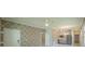 Open living area features neutral paint, decorative geometric walls, tile flooring, and modern lighting at 461 Brunswick Dr, Davenport, FL 33837