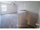 Bright and open loft area with neutral carpeting, a ceiling fan, and plenty of natural light at 461 Brunswick Dr, Davenport, FL 33837