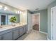 A bright, modern bathroom featuring double sinks, large mirror, and neutral color palette at 461 Brunswick Dr, Davenport, FL 33837