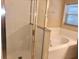 Well-lit bathroom featuring a soaking tub, glass-enclosed shower, and tile flooring at 500 Wellesly St, Oviedo, FL 32765